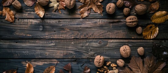 Aufkleber - Vintage wooden table adorned with walnuts and leaves creating a rustic setting with copy space image