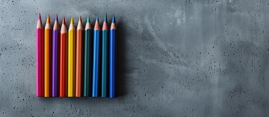 Poster - Vivid and crisp colored pencils stand out against a grey backdrop with ample copy space for your message