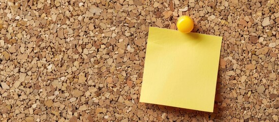 Poster - A yellow memo pinned on a cork notice board with copy space image