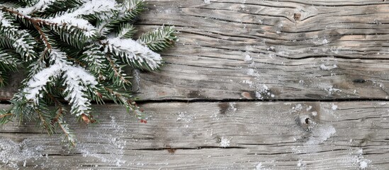 Aufkleber - Snow covered evergreen branch on weathered wood provides a winter themed copy space image for your seasonal messages