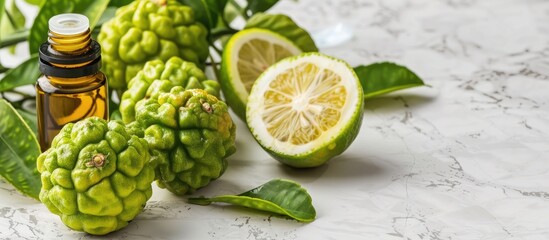 Poster - Fresh bergamot fruits and a bottle of essential oil displayed together on a white marble table with a spacious area available for adding text. with copy space image. Place for adding text or design