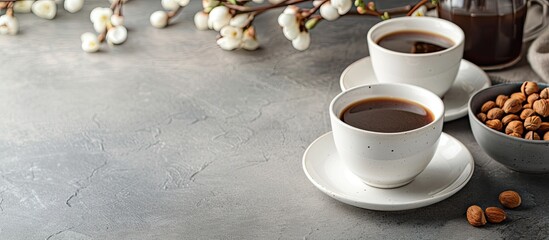 Aufkleber - Coffee cups and a plate of fried nuts are displayed on the table with copy space image