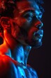 © Pure Imagination - A portrait of a man with a determined expression, illuminated by neon red and blue lights.