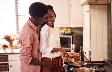 Poster - Happy, couple and cooking in kitchen with hug on valentines day for dinner celebration and lunch date in home. Black people, romance and love with bonding, meal preparation and relationship in house