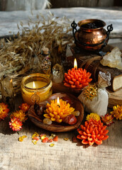 Poster - amulets, flowers, candles, witchcraft items, witch cauldron, wheat ears, crystals on table. magic Esoteric Ritual for Lammas, Lughnasadh. energy healing spiritual practice