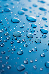 Canvas Print - Close-up of water droplets on a blue surface, highlighting the texture and clarity of the droplets in a clean and simple composition.