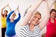 © Leffy/peopleimages.com - Pregnancy yoga, smile and stretching with women in class together for exercise, fitness or health. Gym, studio and wellness with group of happy people in pilates routine for maternal community