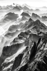 Poster - A black and white photograph of a mountain range with rugged terrain and snow-capped peaks
