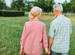 © Lumos sp - woman man outdoor senior couple retirement together walking love holding hands support old nature wife happiness mature elderly