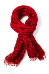 Wall Mural - Red knitted scarf on a white background.