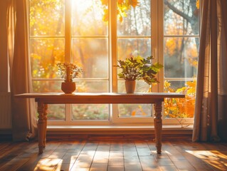 A wooden table with a vase of flowers and a potted plant sitting on it. The table is in front of a window with curtains drawn, and the sunlight is shining through the window, creating a warm