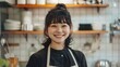 © StudioFF - キッチンに立つ笑顔の日本人女性