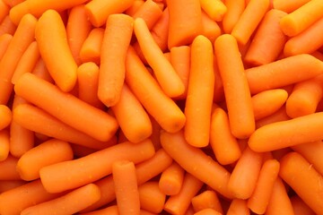 Wall Mural - Many baby carrots as background, top view