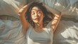 © Farid - Asian women wake up from sleep. are stretch herself in the morning on the weekend sit on the bed at luxury room in Relax and weekend concept.