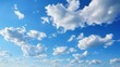 A clear and bright sky with blue skies and white clouds showcasing a beautiful landscape