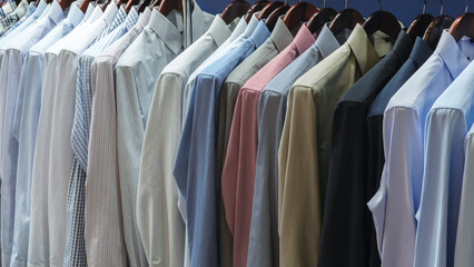 Poster - A row of shirts are hanging on a clothesline, with some being blue and some being white