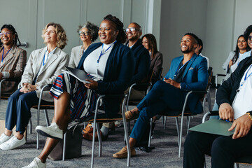 Wall Mural - diverse business audience listening to a presentation at a conference seminar