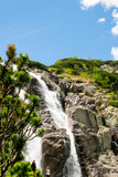Mountain landscape with waterfall in Tatra Mountains, Poland. The largest waterfall in Poland, Wielka Siklawa. The world of beauty.