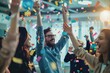 © momostudio - A group of joyful people celebrating with confetti in an office.