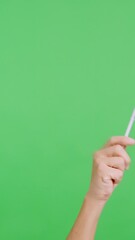 Wall Mural - Hand waving a pennant of a brazilian national flag