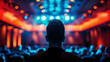 © GenBy - Silhouette of a person watching a colorful stage performance in a dimly lit auditorium, focusing on bright lights and vibrant ambiance. high quality.