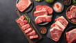 © OMD - Assorted cuts of marbled beef on plates and cutting boards with herbs and seasonings on a dark background.