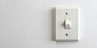 © Adisorn - Old fashioned white light switch mounted on a clean white wall providing ample copy space for text or design overlay, isolated on a bright background.