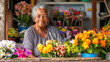 © Jafree - Elderly African American woman surrounded by colorful flowers in a flower shop. Concept of senior florist, flower market, gardening, small business