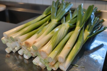 Sticker - Organic leeks with green leaves and white stalks on a modern kitchen surface