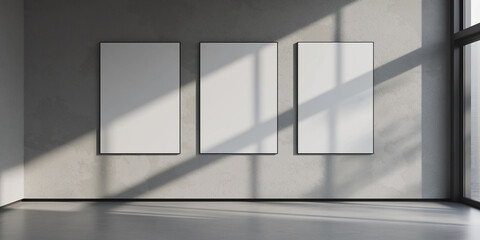 Aufkleber - Sunlight casting shadows from window on three blank vertical frames hanging on gallery wall