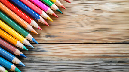 Canvas Print - Colorful pencils on wooden background with copy space for creative design