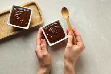 Sticker - Chocolate paste in white bowls on a light background