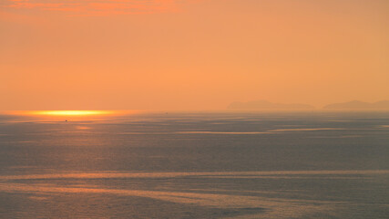 Wall Mural - beautiful view of golden sea and sky in the evening, natural background