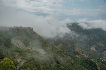 Wall Mural - clouds over the mountains