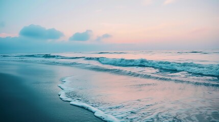 Poster - A beach at sunset with a pink and blue sky.