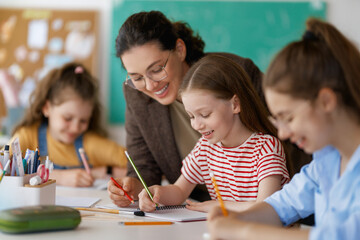 Wall Mural - Happy kids and teacher at school