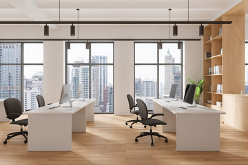 Wall Mural - Stylish coworking interior with tables and pc desktop, panoramic window