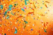 © Igor - Celebration and colorful confetti party on orange abstract background