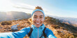 © Aigo labs - hispanic woman. A young woman hiker smiles brightly as she takes a selfie on a mountaintop, capturing the stunning panoramic view behind her.