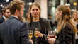 © Lizbond - Networking event with diverse business professionals engaging in conversation at evening gathering