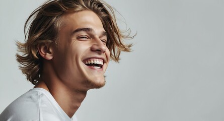 Poster - teen laughing guy on plain white background model portrait lifestyle hair skin care ad concept copy space