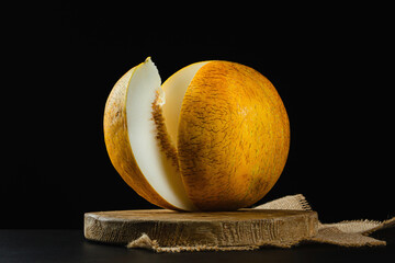 Wall Mural - Sliced ​​melon on black background