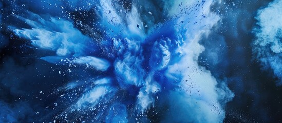 Poster - A freeze frame image capturing an explosion of blue powder against a splattered background with ample copy space
