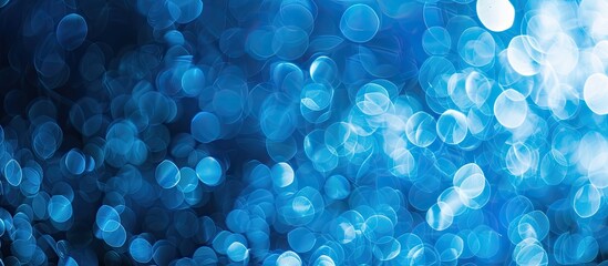 Poster - Blue themed abstract bokeh background with copy space image included