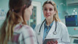 © Muhammad - medicine, healthcare and people concept - female doctor with tablet pc computer talking to woman patient at hospital -