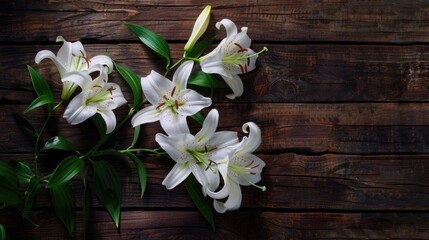 Sticker - Elegant lilies arranged on a dark wooden floor, their white petals standing out beautifully against the wood.