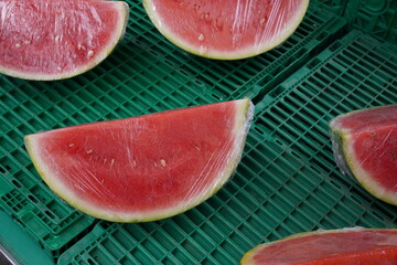 Slices of fresh watermelon at market. juicy summer fruit and refreshing snack. 