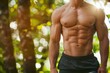 © Igor - Cropped image of an athletic man with beautiful flat belly nature blurred background