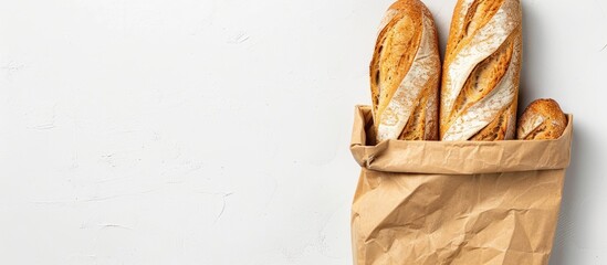 Aufkleber - Top view of a bread filled paper bag on a white background with space for text in the image. copy space available