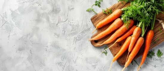 Poster - A wooden board displaying fresh carrots against a light backdrop with spacious copy space image